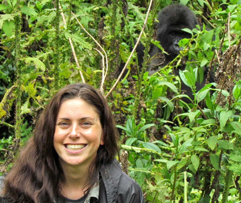 Dr. Alisa Kubala in the field with a mountain gorilla. 