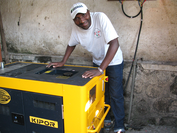 DRC Head Veterinarian Dr. Eddy Kambale with the new generator.